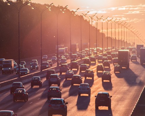 Evening traffic in a city during golden hour
